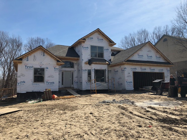 Before photo of new brick facade home addition in Farmington, Michigan
